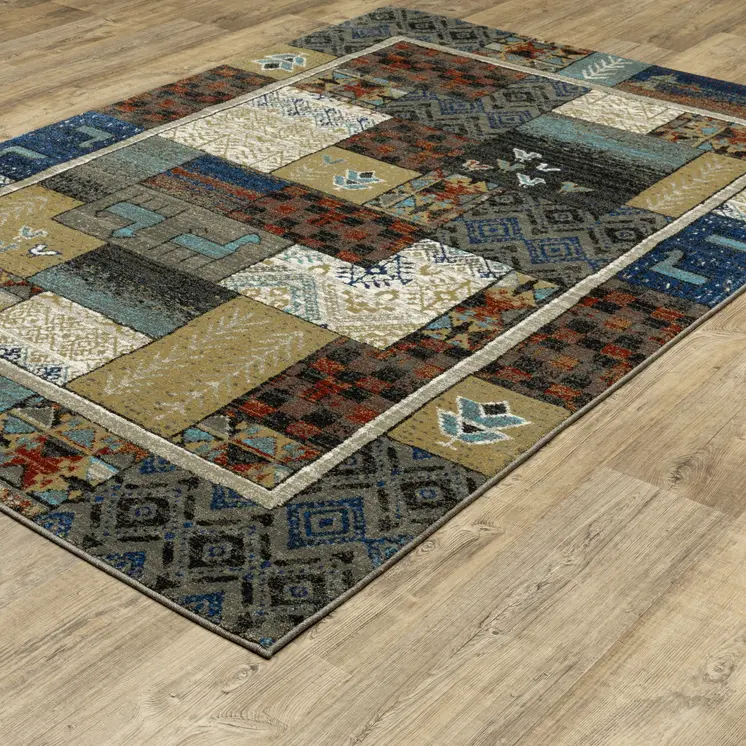 10' X 13' Brown Tan And Blue Patchwork Area Rug