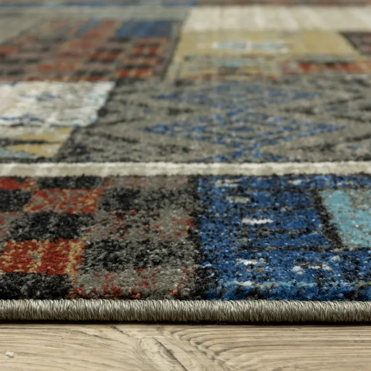 10' X 13' Brown Tan And Blue Patchwork Area Rug
