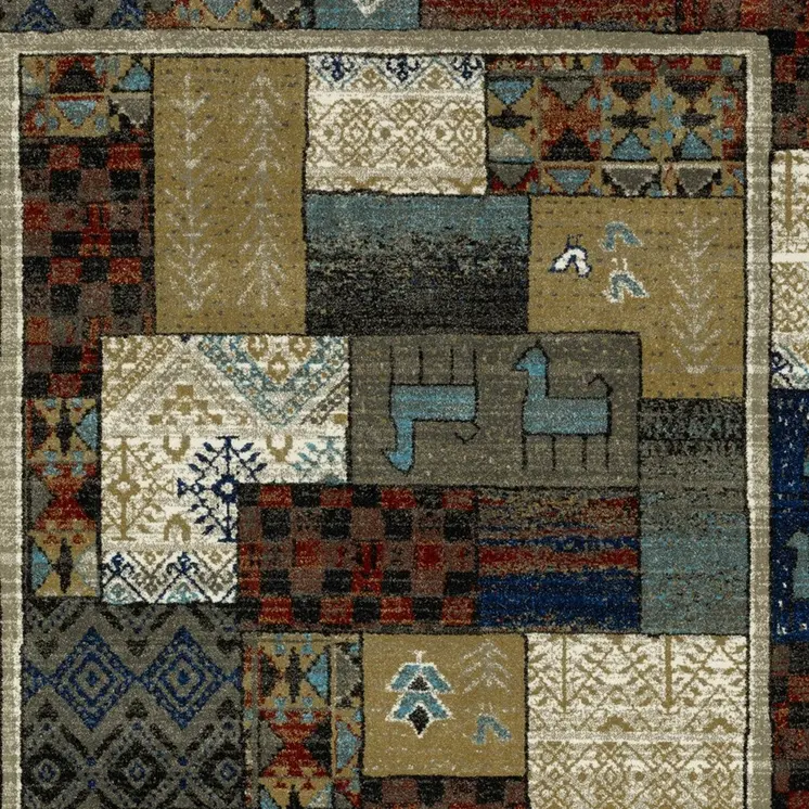 10' X 13' Brown Tan And Blue Patchwork Area Rug