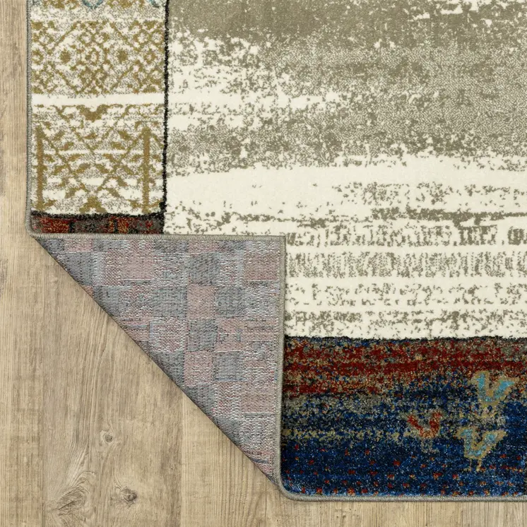 5' X 7' Ivory Tan And Blue Patchwork Area Rug