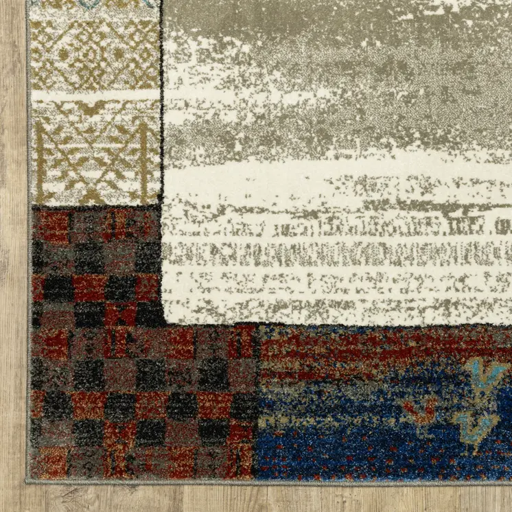5' X 7' Ivory Tan And Blue Patchwork Area Rug