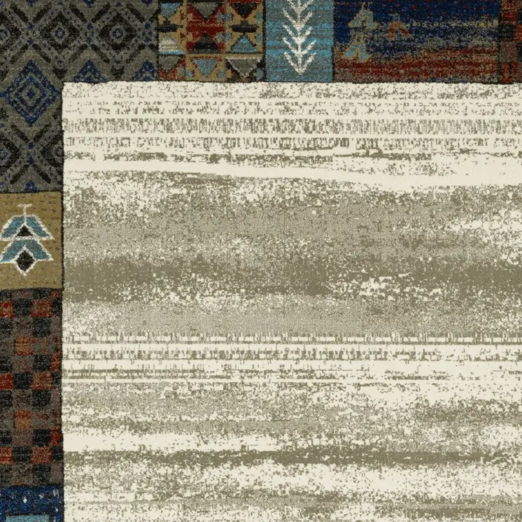 7' X 9' Ivory Tan And Blue Patchwork Area Rug