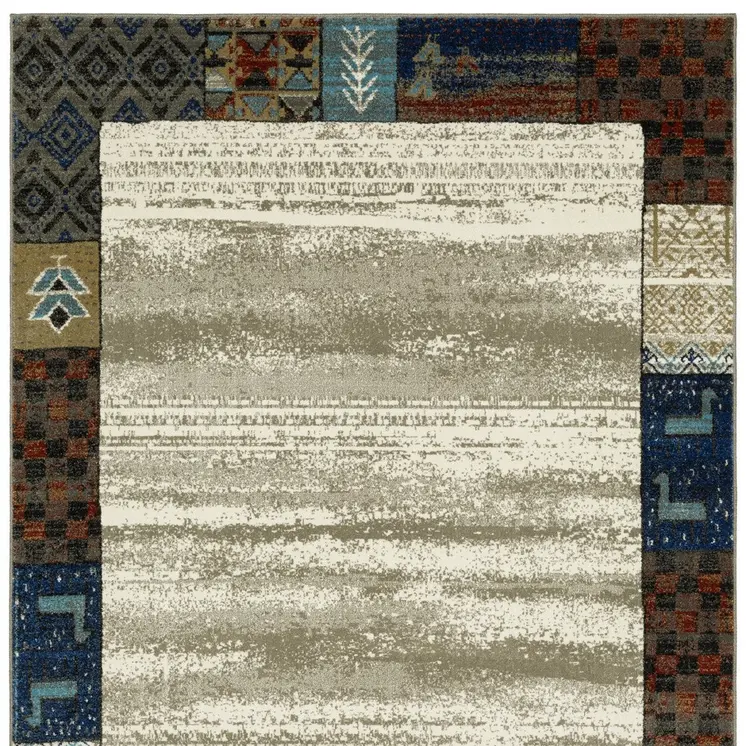 7' X 9' Ivory Tan And Blue Patchwork Area Rug