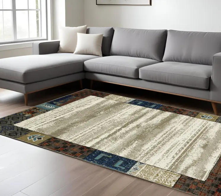 7' X 9' Ivory Tan And Blue Patchwork Area Rug
