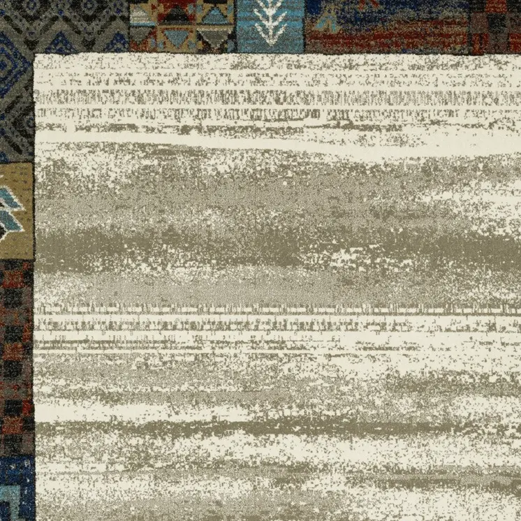 8' X 10' Ivory Tan And Blue Patchwork Area Rug
