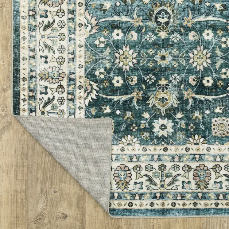 4' X 6' Teal And Ivory Oriental Distressed Area Rug
