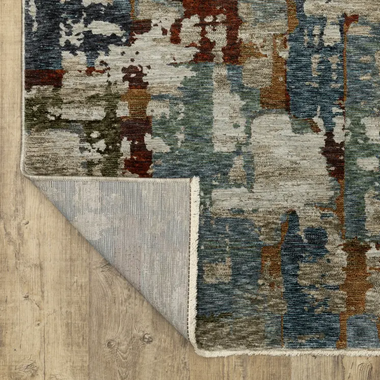 7' X 10' Beige Rust And Teal Abstract Distressed Area Rug With Fringe