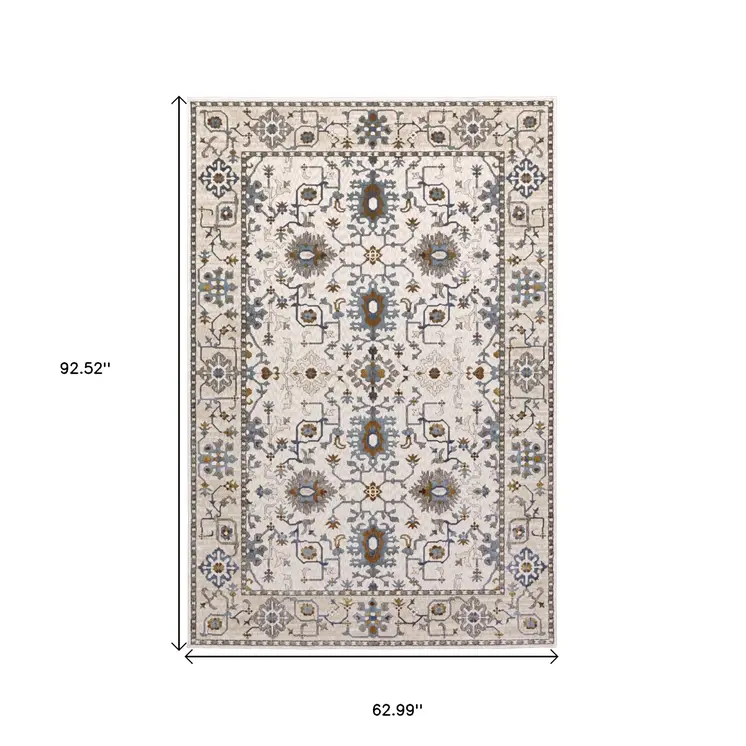 5' X 8' Ivory Burnt Orange And Blue Oriental Area Rug