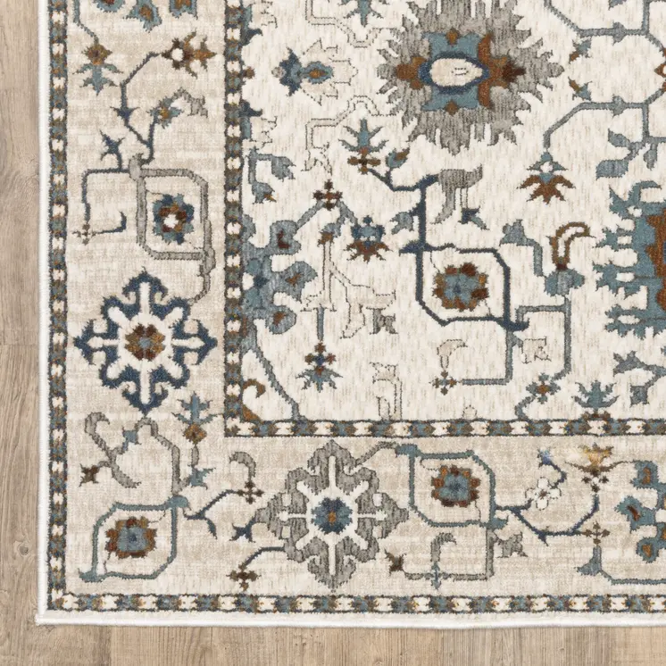 5' X 8' Ivory Burnt Orange And Blue Oriental Area Rug
