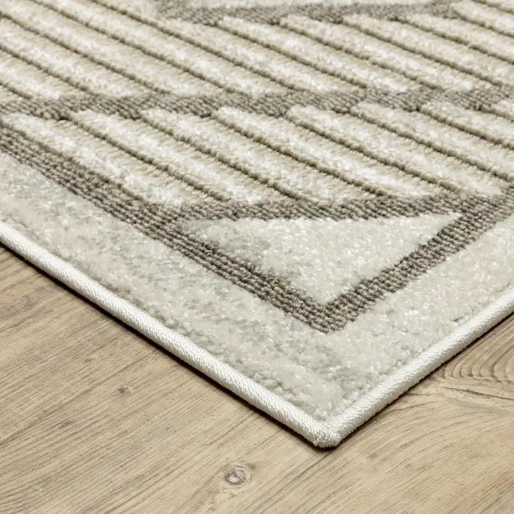 7' X 10' Beige And Brown Geometric Area Rug