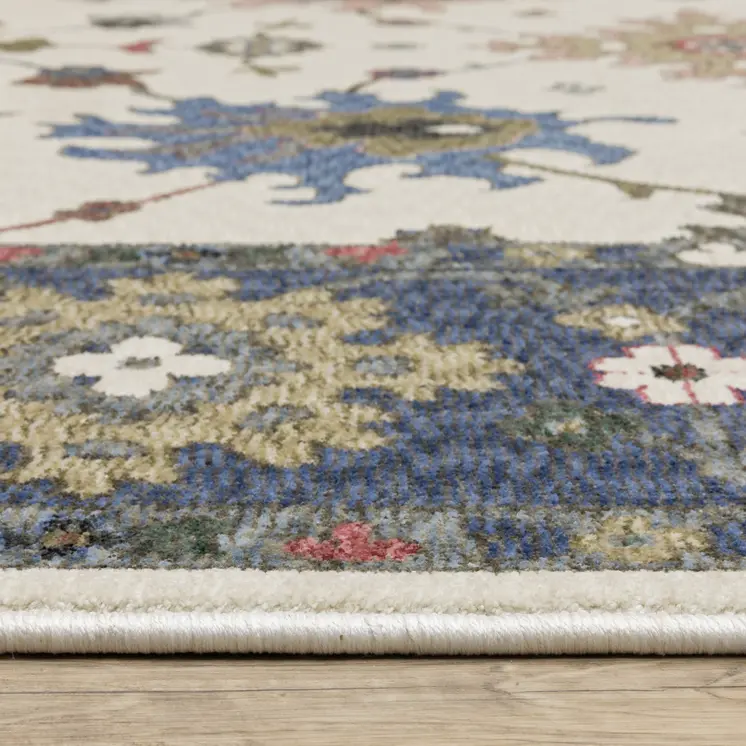5' X 8' Blue And Ivory Floral Area Rug With Fringe