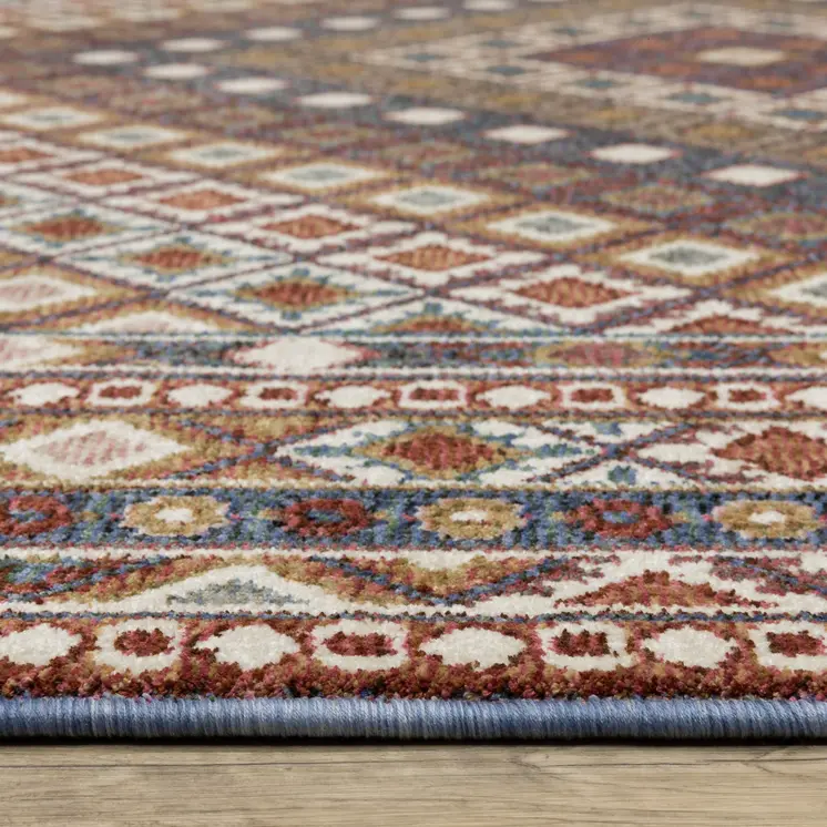 7' X 10' Ivory Red And Tan Diamond Area Rug With Fringe