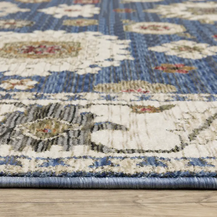 5' X 8' Blue And Ivory Floral Area Rug With Fringe