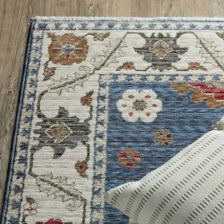 5' X 8' Blue And Ivory Floral Area Rug With Fringe