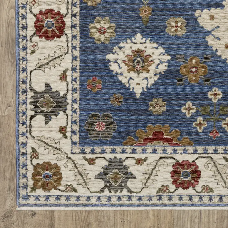 5' X 8' Blue And Ivory Floral Area Rug With Fringe