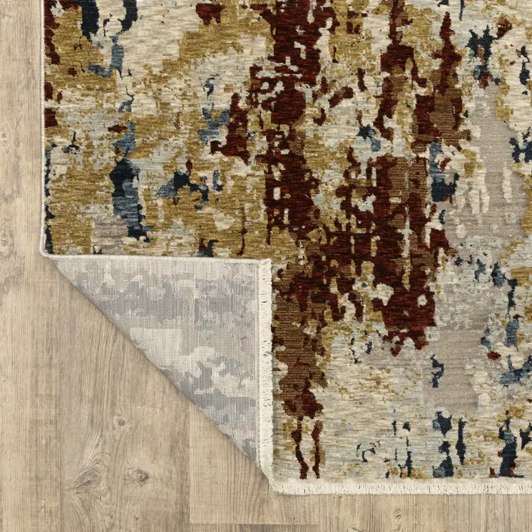 10' X 13' Beige Rust And Light Blue Abstract Distressed Area Rug With Fringe
