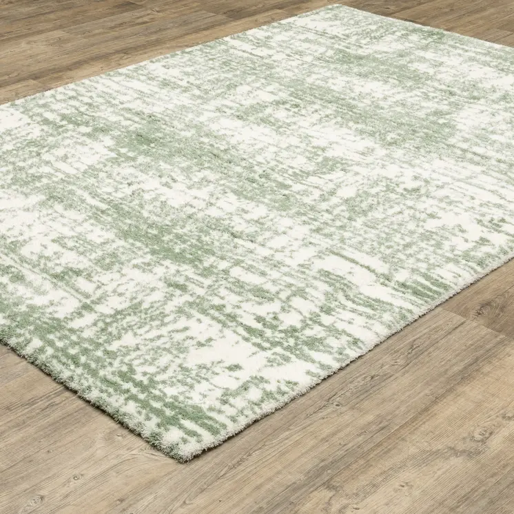 5' X 8' Green And Ivory Abstract Area Rug