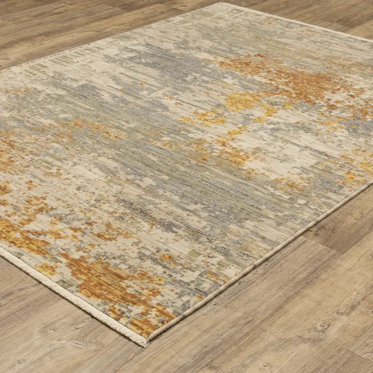 2' X 3' Beige And Gold Abstract Area Rug With Fringe