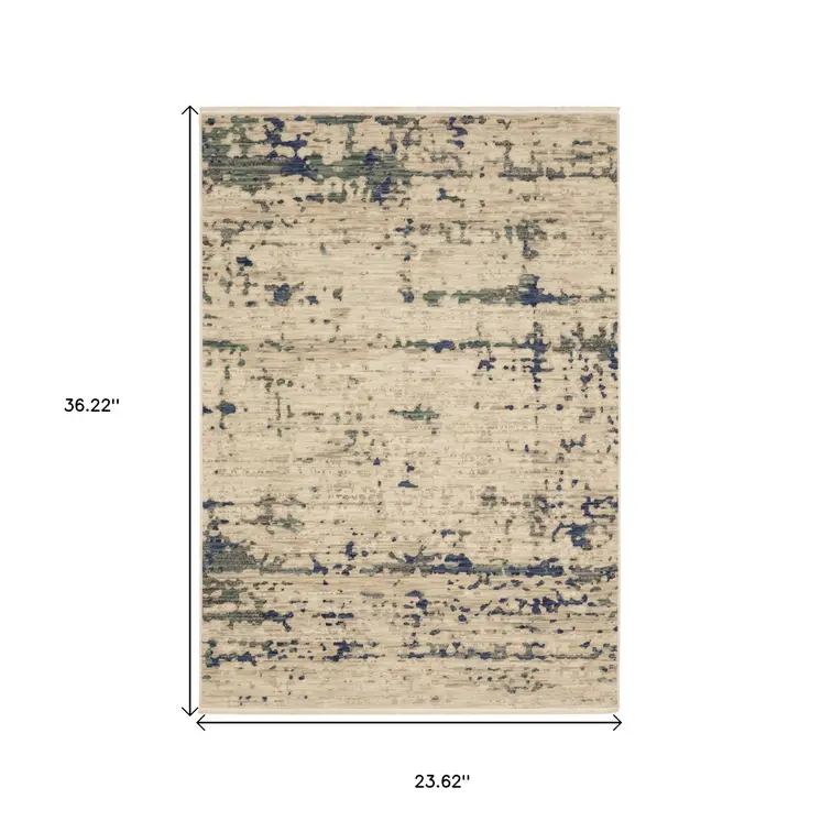 2' X 3' Beige And Green Abstract Area Rug With Fringe