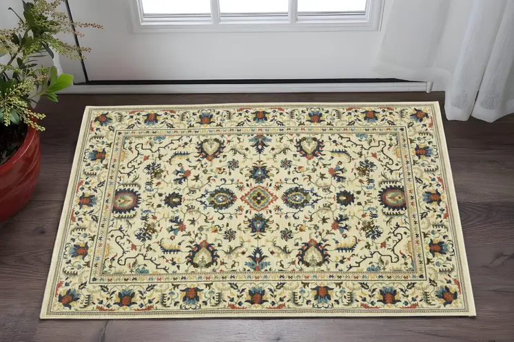 3' X 5' Ivory Blue And Brown Oriental Area Rug With Fringe