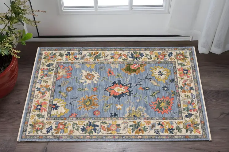 3' X 5' Blue Yellow And Ivory Oriental Area Rug With Fringe