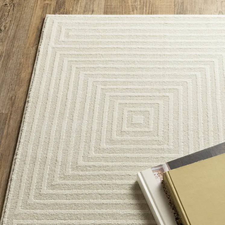 5' X 8' Ivory And Beige Geometric Area Rug