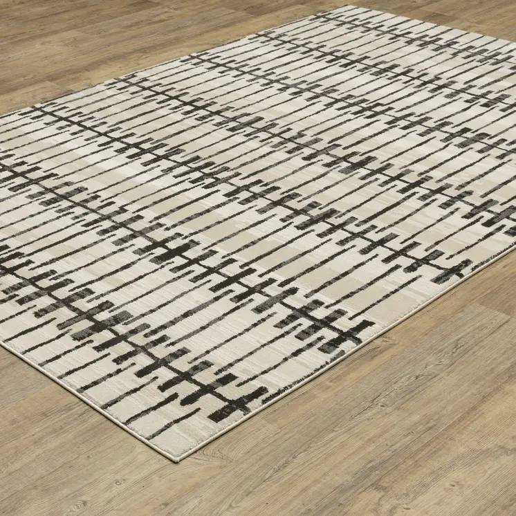 5' X 8' Beige And Black Geometric Area Rug