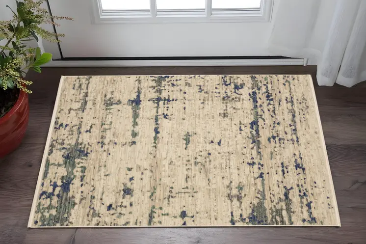 3' X 5' Beige And Green Abstract Area Rug With Fringe
