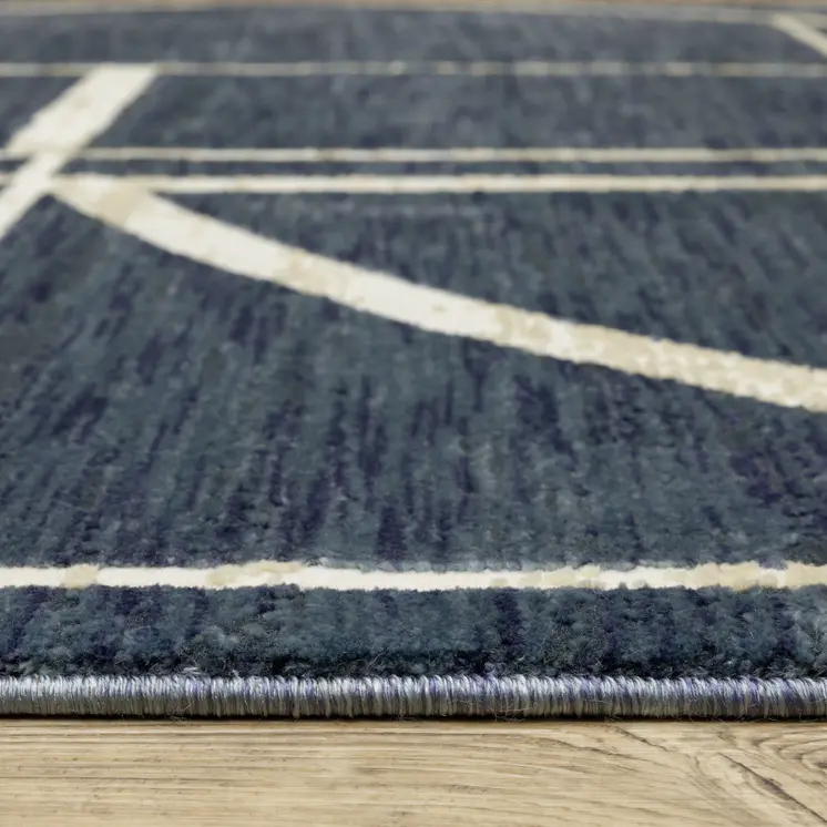 5' X 8' Blue And Ivory Geometric Area Rug