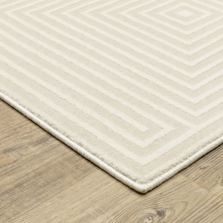 7' X 10' Ivory And Beige Geometric Area Rug