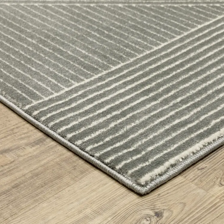 7' X 10' Gray And Ivory Geometric Area Rug