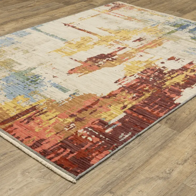 5' X 8' Beige Yellow And Salmon Abstract Area Rug With Fringe