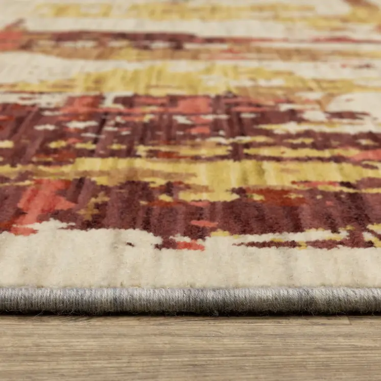5' X 8' Beige Yellow And Salmon Abstract Area Rug With Fringe