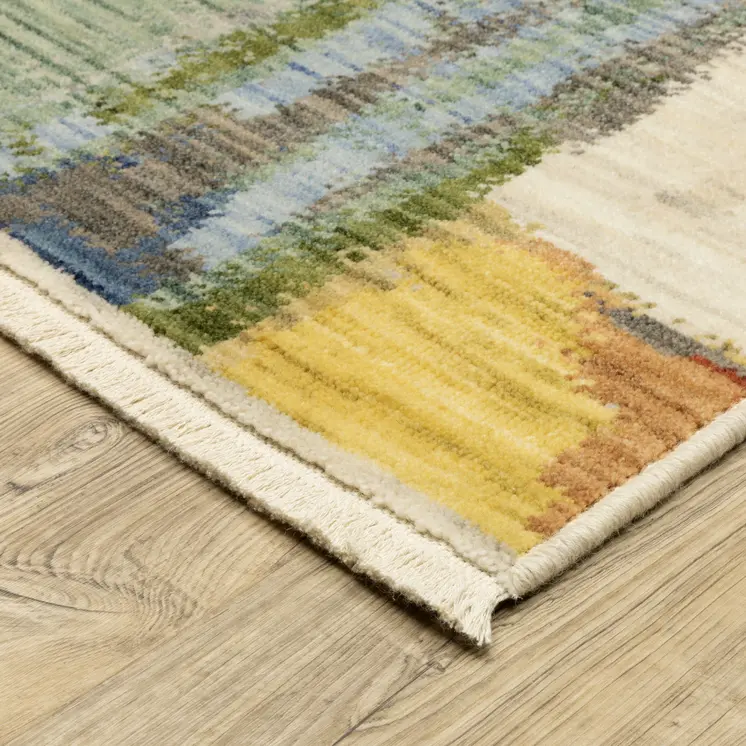 5' X 8' Beige Yellow And Salmon Abstract Area Rug With Fringe