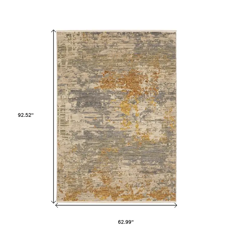 5' X 8' Beige And Gold Abstract Area Rug With Fringe