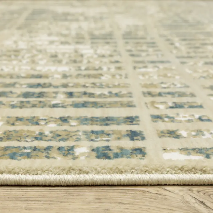 7' X 10' Beige And Blue Geometric Area Rug