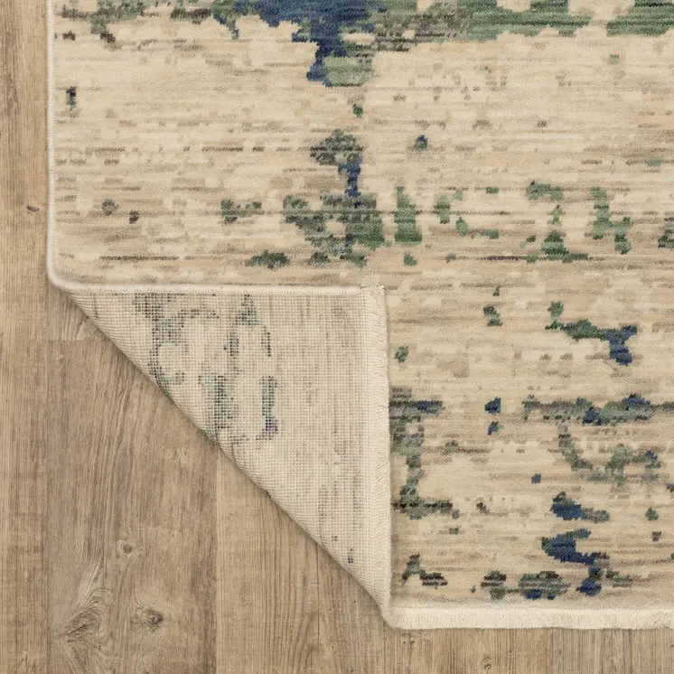7' X 10' Beige And Green Abstract Area Rug With Fringe