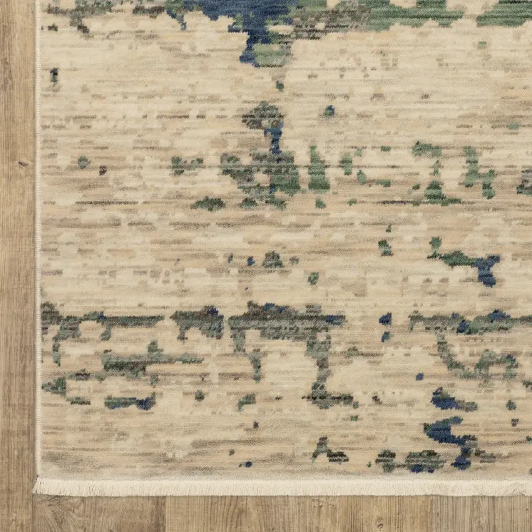 7' X 10' Beige And Green Abstract Area Rug With Fringe
