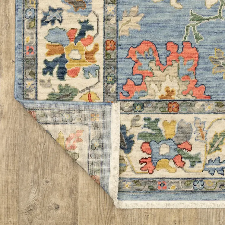 5' X 8' Blue Yellow And Salmon Oriental Area Rug With Fringe