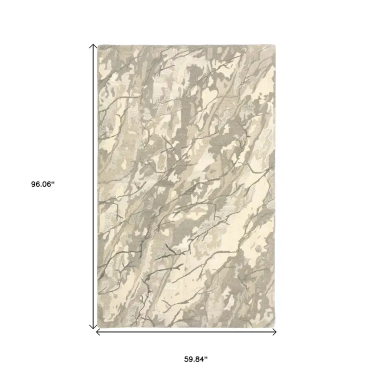 5' X 8' Beige And Ivory Wool Abstract Hand Tufted Area Rug