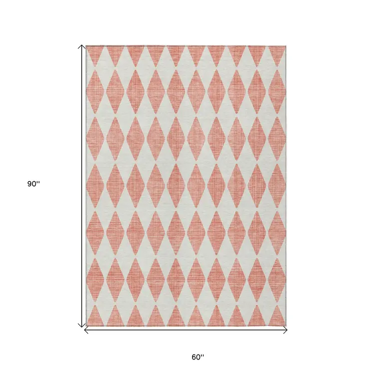 5' X 8' Salmon And Ivory Geometric Washable Indoor Outdoor Area Rug