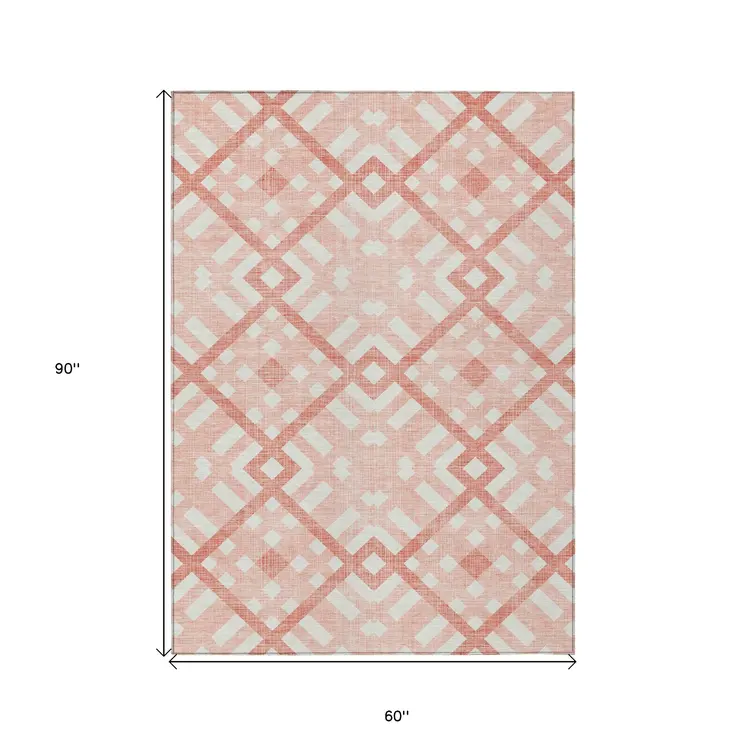 5' X 8' Salmon Peach And Ivory Geometric Washable Indoor Outdoor Area Rug