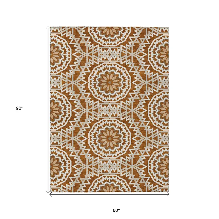 5' X 8' Orange Copper And Beige Floral Medallion Washable Indoor Outdoor Area Rug