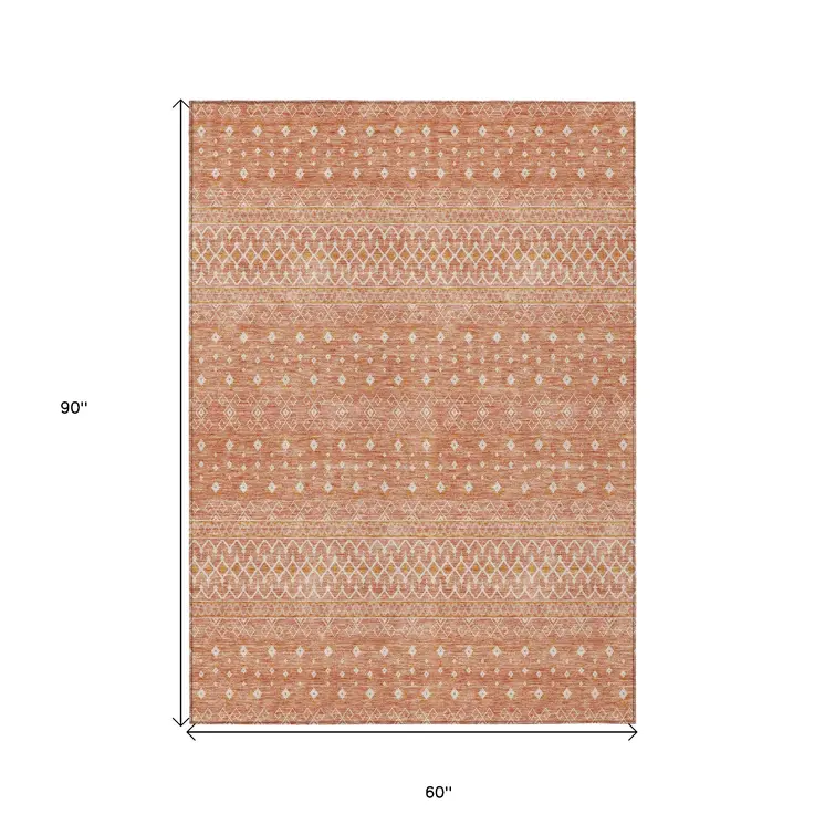 5' X 8' Salmon Gold And Ivory Tribal Washable Indoor Outdoor Area Rug
