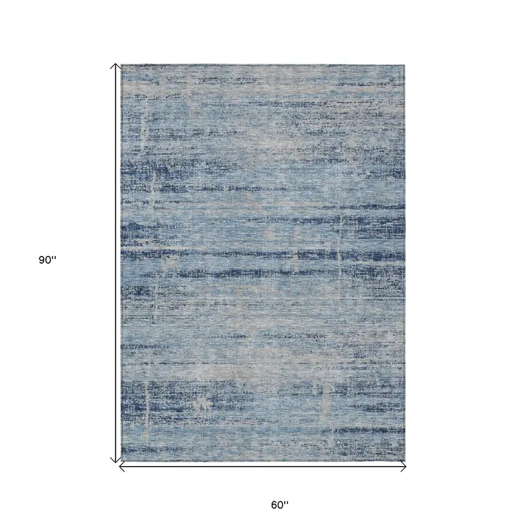 5' X 8' Sky Blue And Navy Blue Abstract Washable Indoor Outdoor Area Rug