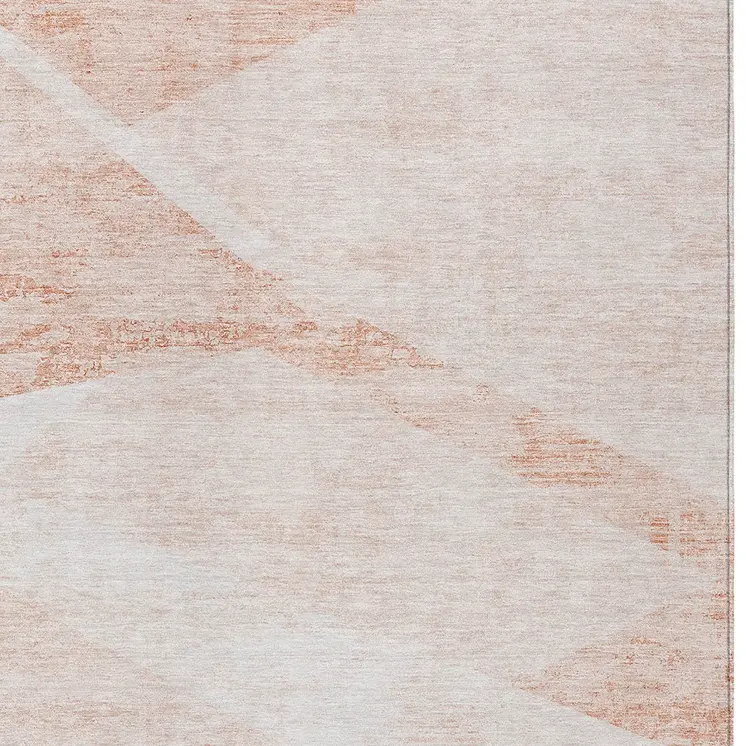 8' X 10' Salmon Peach And Ivory Abstract Washable Indoor Outdoor Area Rug
