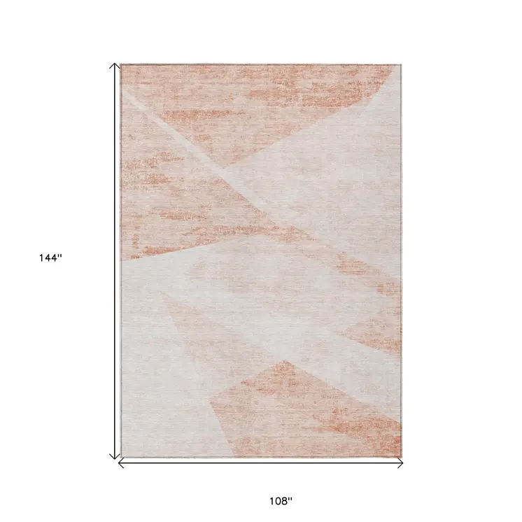 9' X 12' Salmon Peach And Ivory Abstract Washable Indoor Outdoor Area Rug