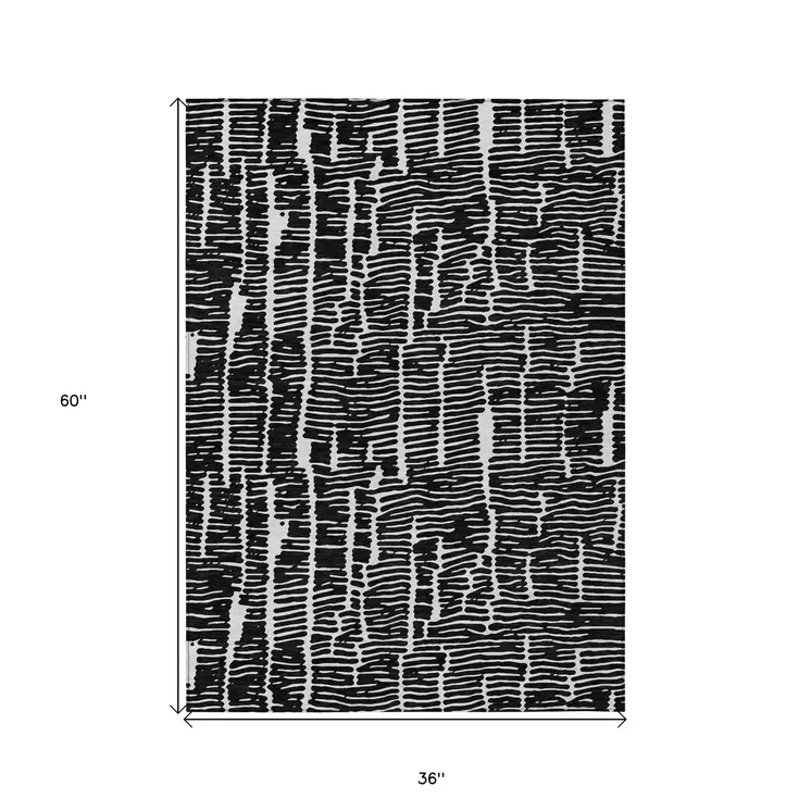 3' X 5' Black And Ivory Abstract Washable Indoor Outdoor Area Rug