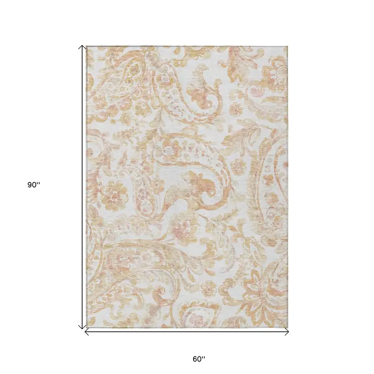 5' X 8' Coral Ivory And Peach Paisley Washable Indoor Outdoor Area Rug