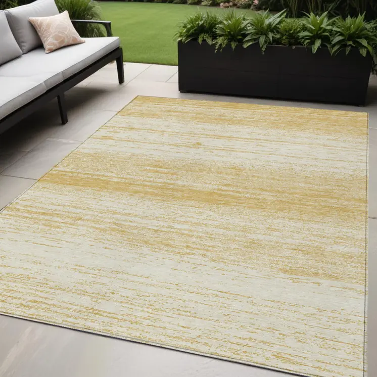 5' X 8' Gold And Ivory Striped Washable Indoor Outdoor Area Rug
